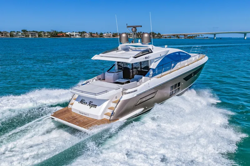 Slide: The Image of Luxury 2020 Azimut S6 yacht cruising on clear blue waters. - 45