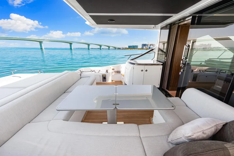 Slide: The Image of Luxurious 2020 Azimut S6 yacht interior with elegant seating and ocean view. - 82