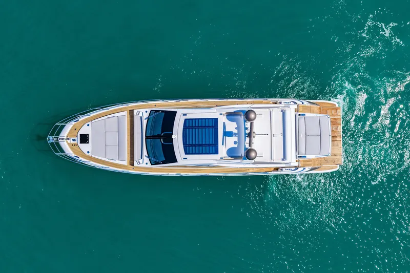 Slide: The Image of Top view of a 2020 Azimut S6 yacht cruising on turquoise water. - 30