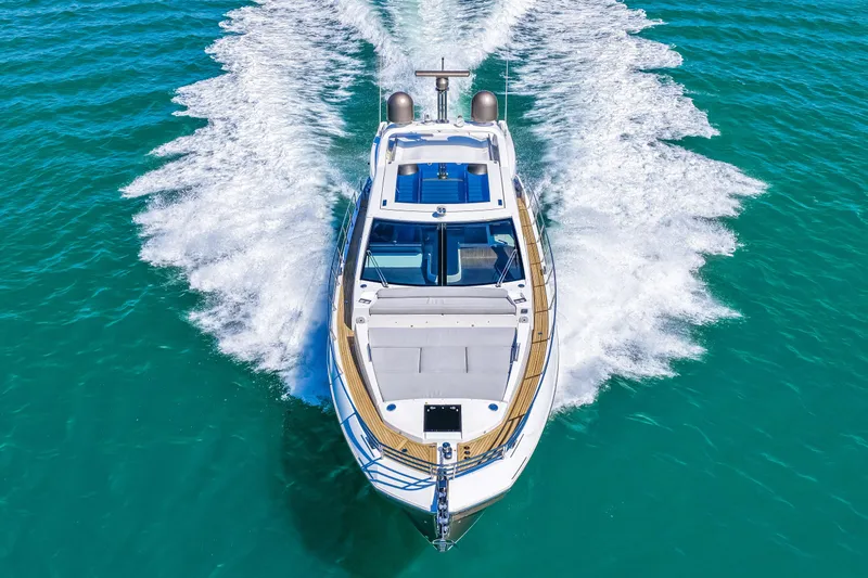 Slide: The Image of 2020 Azimut S6 yacht cruising on clear turquoise waters, aerial view. - 55