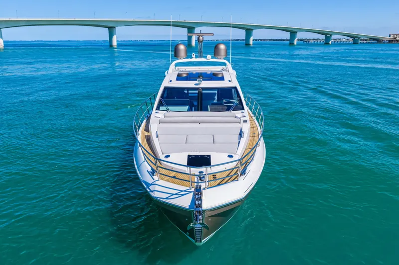 Slide: The Image of Azimut S6 2020 yacht cruising on clear blue waters near a bridge. - 9