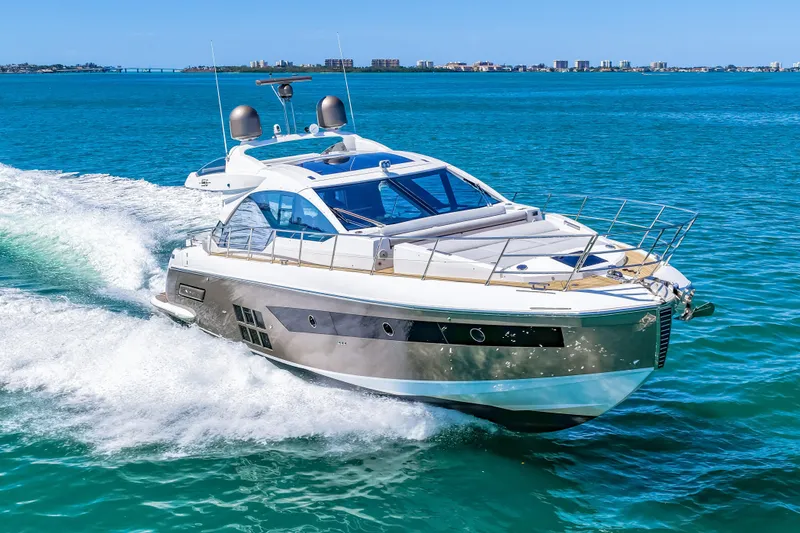 Slide: The Image of 2020 Azimut S6 yacht cruising on clear blue ocean waters. - 67