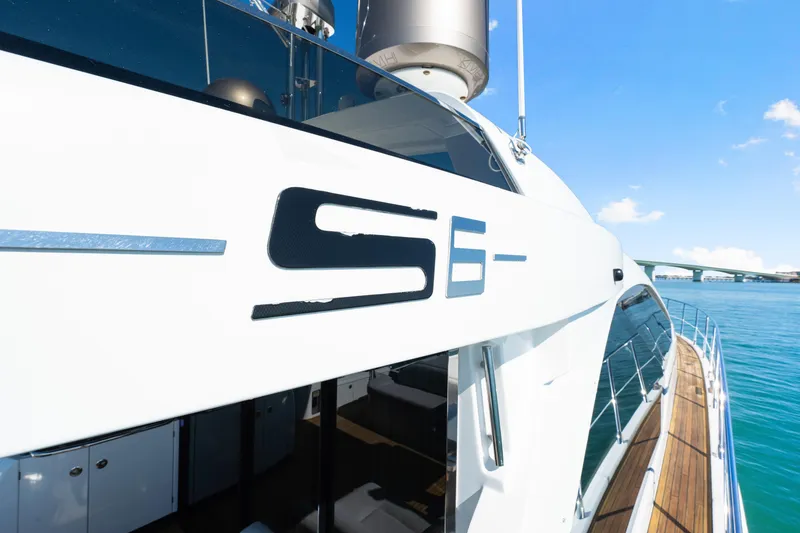 Slide: The Image of 2020 Azimut S6 yacht on clear blue water, showcasing sleek design and luxury features. - 88