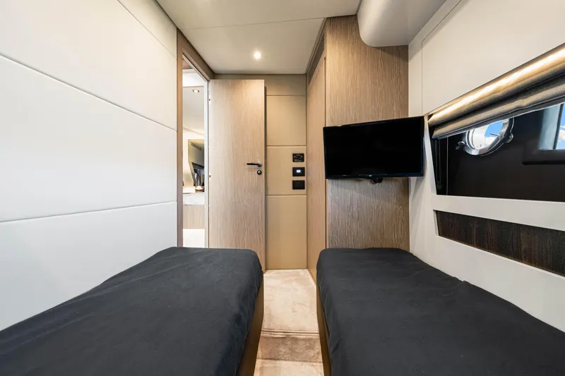 Slide: The Image of Luxurious interior of 2020 Azimut S6 yacht cabin with twin beds and TV. - 114