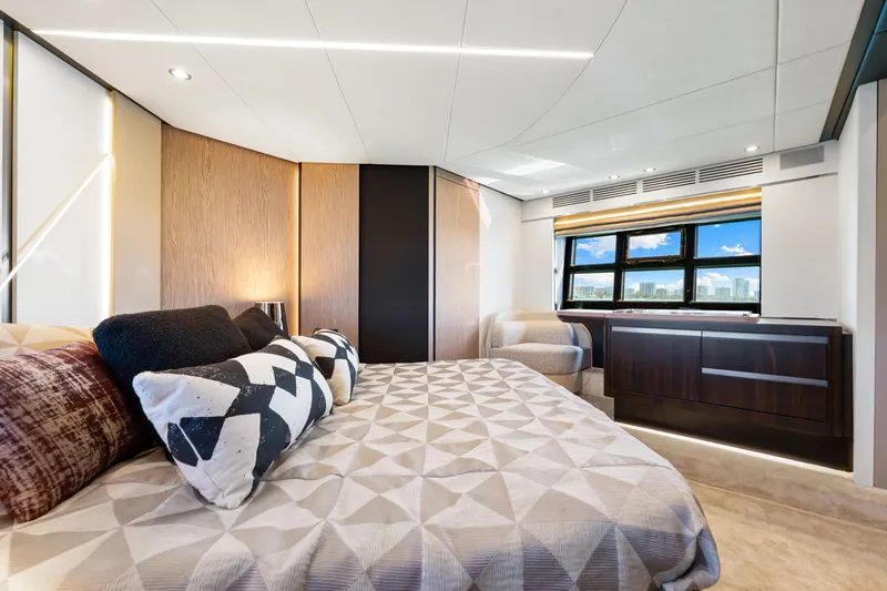 Slide: The Image of Luxurious interior of 2020 Azimut S6 yacht bedroom with modern design and large window view. - 103