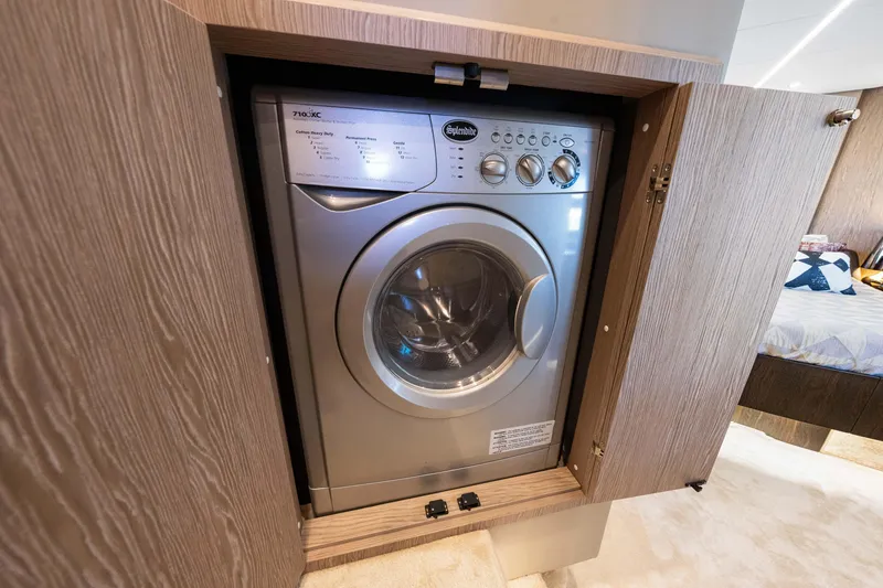 Slide: The Image of Built-in washing machine on 2020 Azimut S6 yacht, wooden cabinet enclosure. - 109