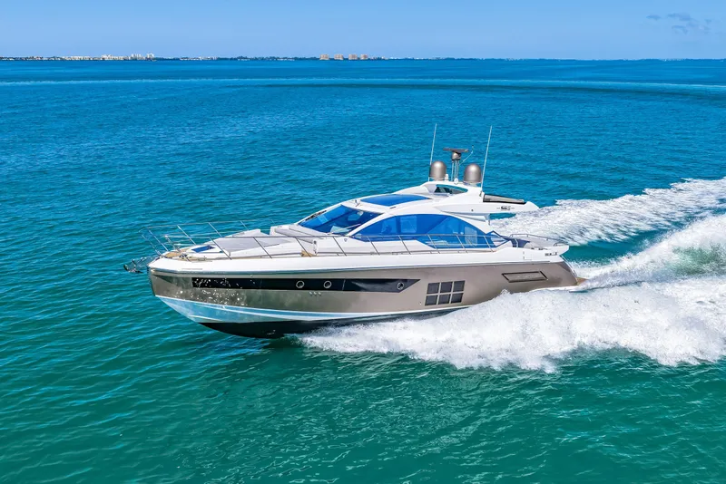Slide: The Image of 2020 Azimut S6 yacht cruising on clear blue ocean waters. - 59