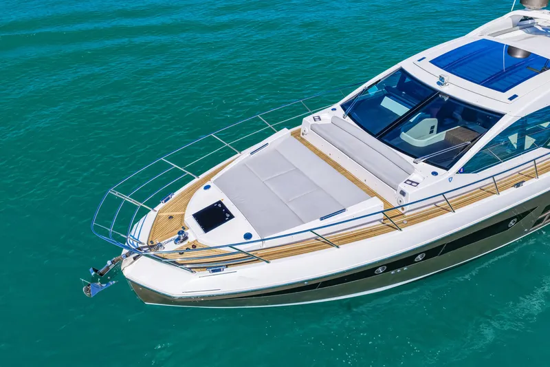 Slide: The Image of 2020 Azimut S6 yacht on turquoise water, showcasing sleek design and luxury features. - 7