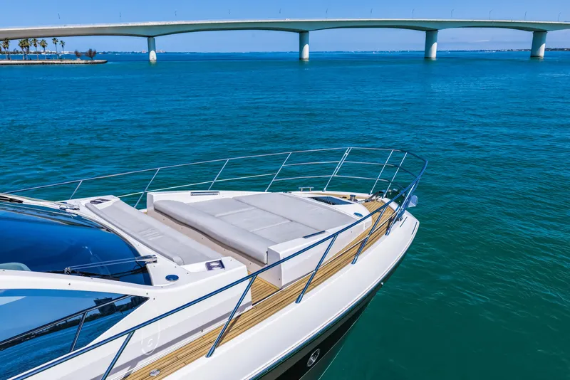 Slide: The Image of 2020 Azimut S6 yacht on blue water near a bridge, showcasing luxury design. - 35