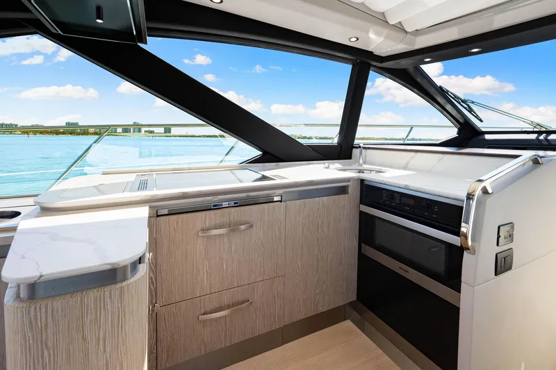 Slide: The Image of Luxurious interior of 2020 Azimut S6 yacht with modern kitchen and ocean view. - 96