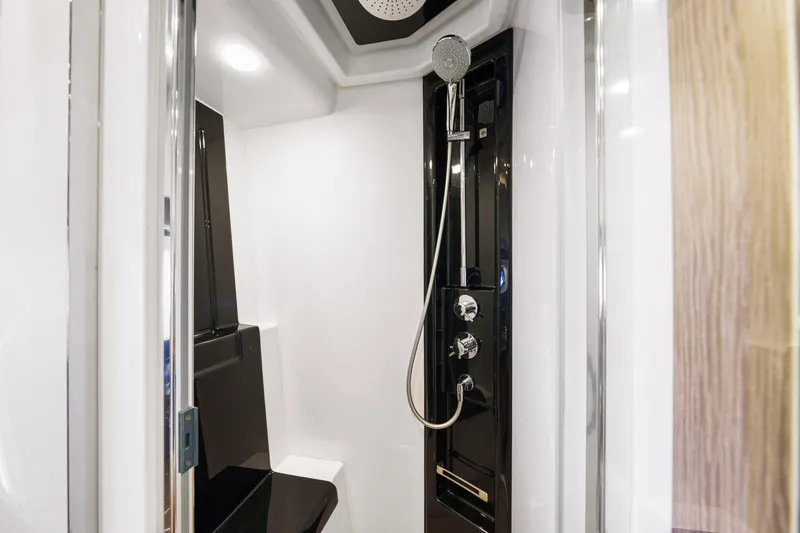Slide: The Image of Luxurious shower in 2020 Azimut S6 yacht, featuring sleek black and white design. - 108