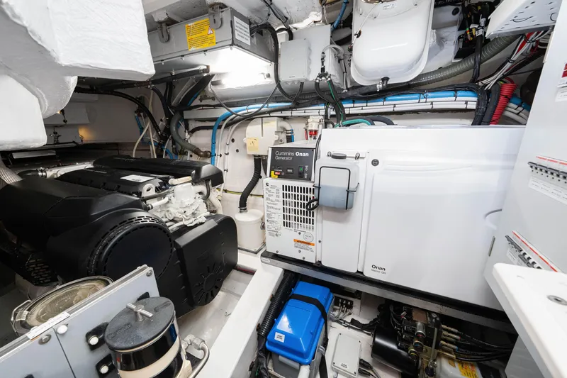 Slide: The Image of Engine room of a 2020 Azimut S6 yacht featuring a Cummins Onan generator. - 117
