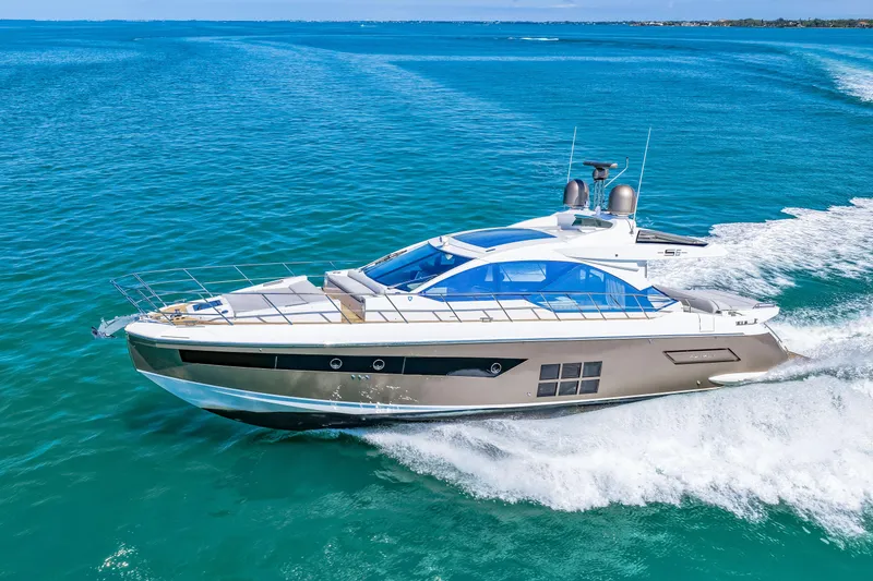 Slide: The Image of 2020 Azimut S6 yacht cruising on clear blue ocean waters. - 61