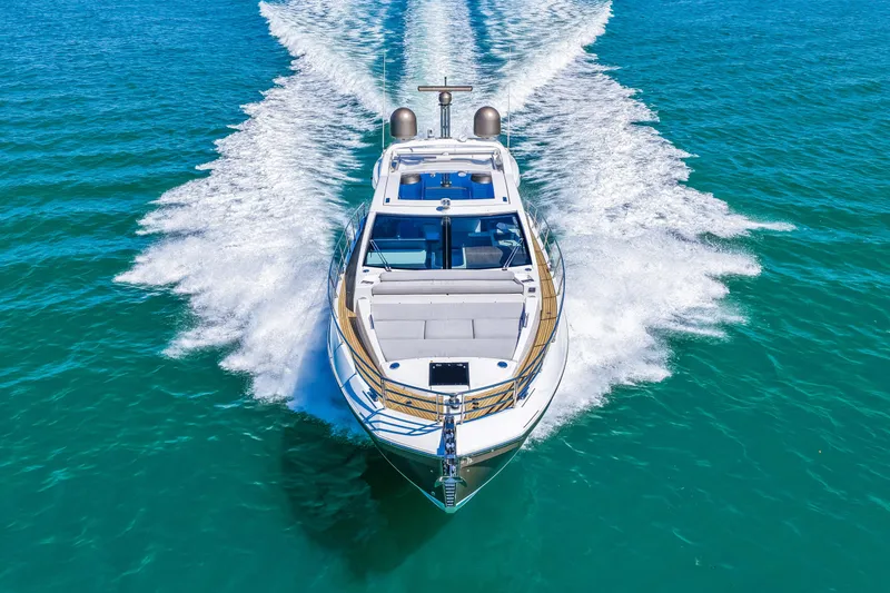 Slide: The Image of 2020 Azimut S6 yacht cruising on clear blue ocean waters. - 54