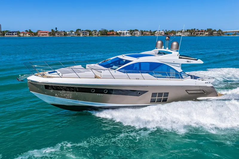 Slide: The Image of Luxury 2020 Azimut S6 yacht cruising on clear blue waters. - 44