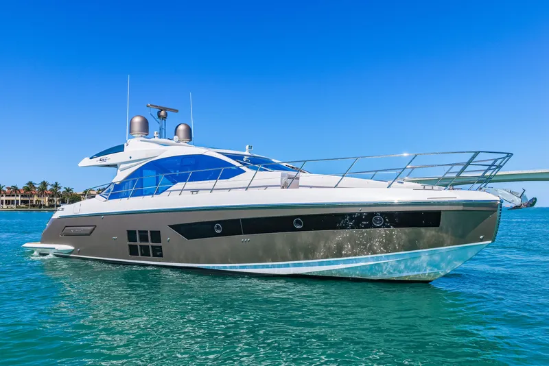 Slide: The Image of 2020 Azimut S6 yacht cruising on clear blue waters under a sunny sky. - 39