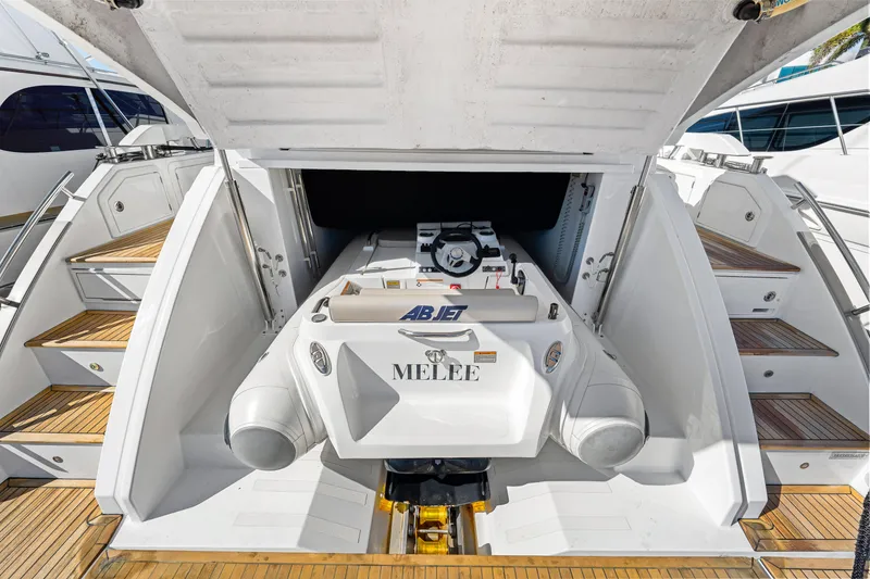Slide: The Image of 2020 Azimut S6 yacht with a tender in the garage, showcasing luxury features. - 86