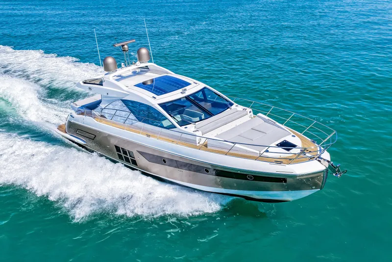 Slide: The Image of Luxurious 2020 Azimut S6 yacht cruising on clear blue waters. - 70