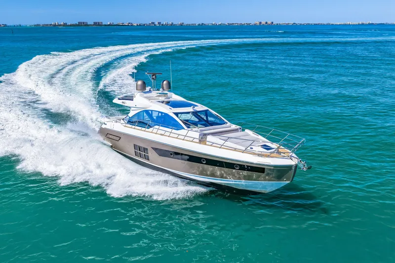 Slide: The Image of 2020 Azimut S6 yacht cruising on clear blue ocean waters. - 72