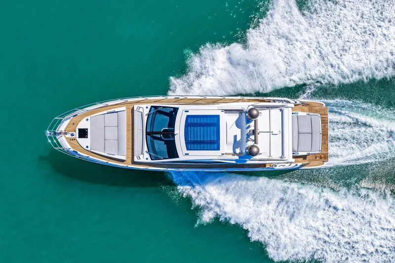 Slide: The Image of Aerial view of 2020 Azimut S6 yacht cruising on turquoise water. - 53