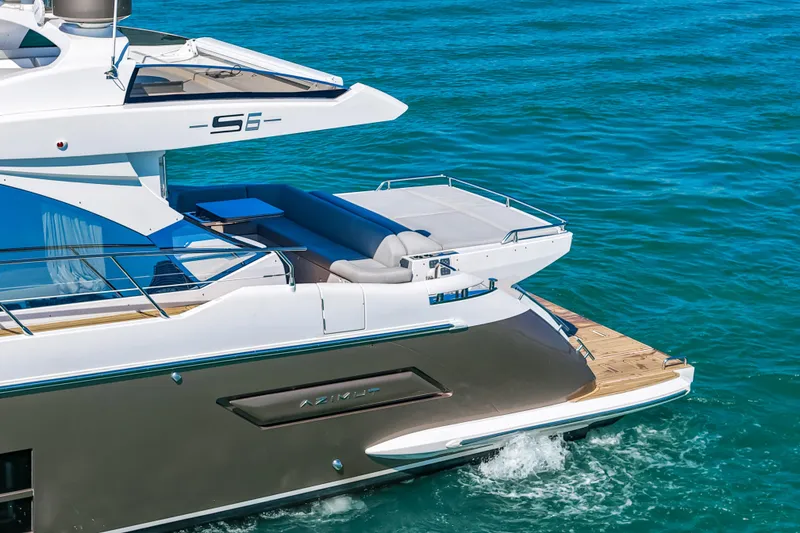 Slide: The Image of Luxury 2020 Azimut S6 yacht cruising on clear blue waters. - 13