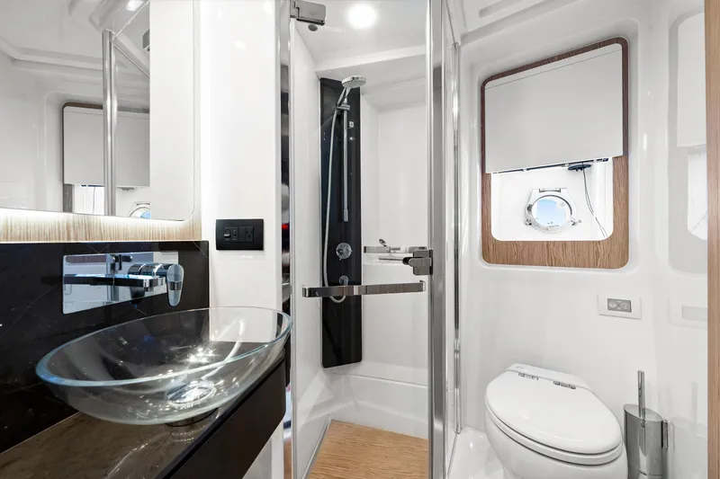 Slide: The Image of Luxurious bathroom in 2020 Azimut S6 yacht with modern fixtures and glass sink. - 112