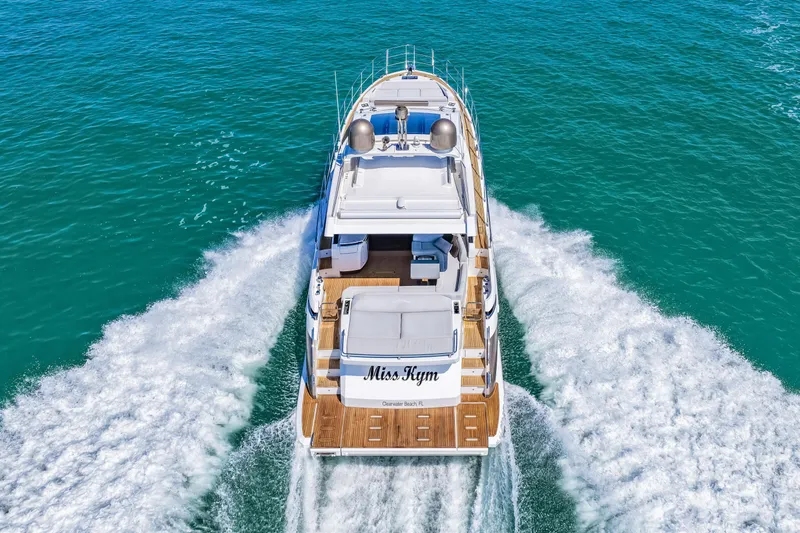 Slide: The Image of 2020 Azimut S6 yacht cruising on clear blue waters, aerial rear view. - 50