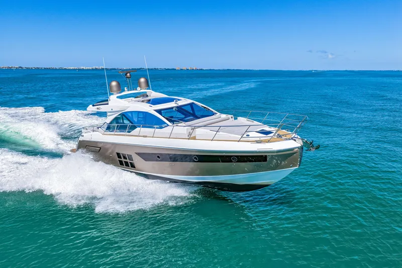 Slide: The Image of 2020 Azimut S6 yacht cruising on clear blue ocean waters. - 68