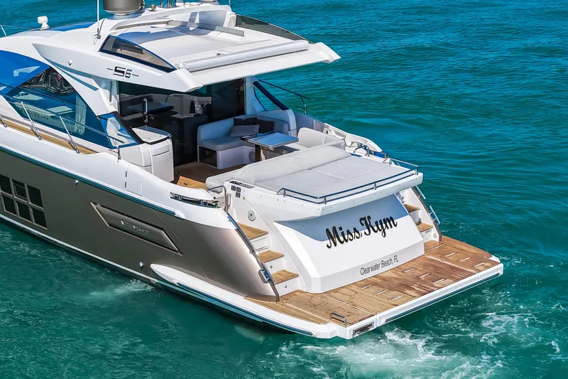 Slide: The Image of Luxury 2020 Azimut S6 yacht cruising in clear blue waters. - 26