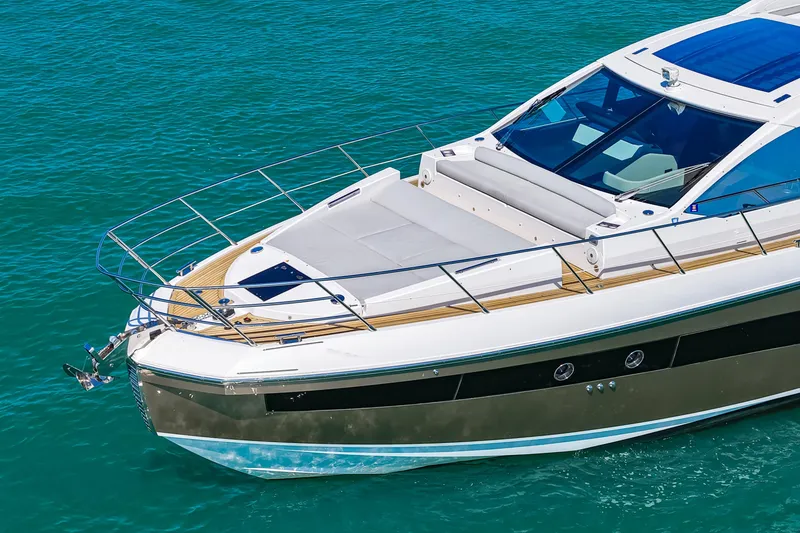 Slide: The Image of 2020 Azimut S6 yacht cruising on clear blue water. - 11