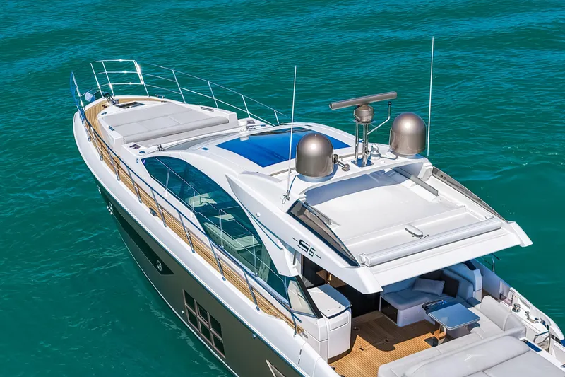 Slide: The Image of 2020 Azimut S6 luxury yacht cruising on clear blue waters. - 27