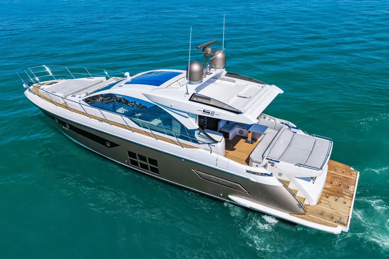Slide: The Image of Luxurious 2020 Azimut S6 yacht cruising on clear blue waters, showcasing sleek design and elegance. - 18