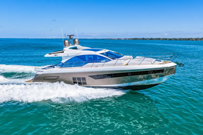 Slide: The Image of 2020 Azimut S6 yacht cruising on clear blue ocean waters. - 69