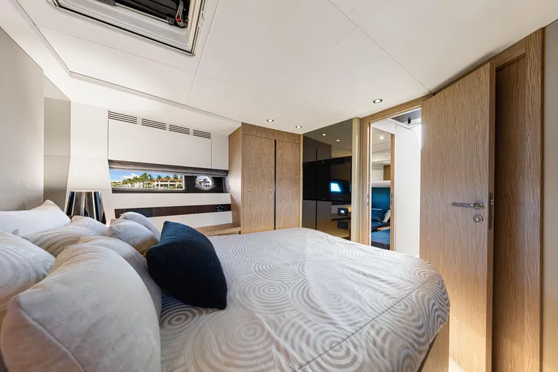 Slide: The Image of Luxurious interior of 2020 Azimut S6 yacht bedroom with modern design and elegant furnishings. - 111