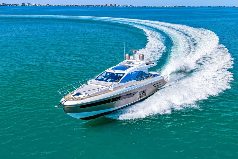 Slide: The Image of 2020 Azimut S6 yacht cruising on clear blue ocean waters. - 58