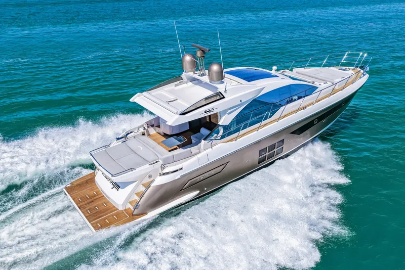 Slide: The Image of 2020 Azimut S6 yacht cruising on clear blue ocean waters. - 48