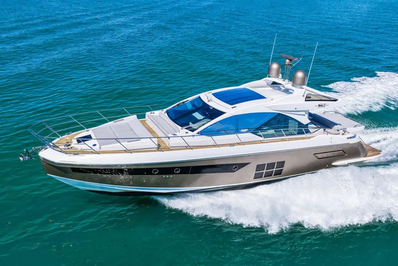 Slide: The Image of Luxury 2020 Azimut S6 yacht cruising on clear blue waters. - 60