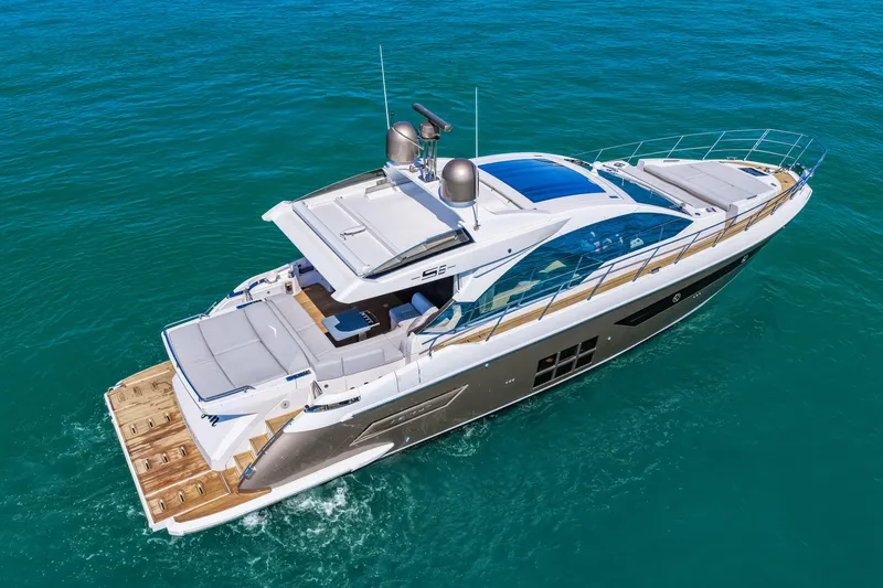 Slide: The Image of 2020 Azimut S6 luxury yacht cruising on clear blue waters. - 34