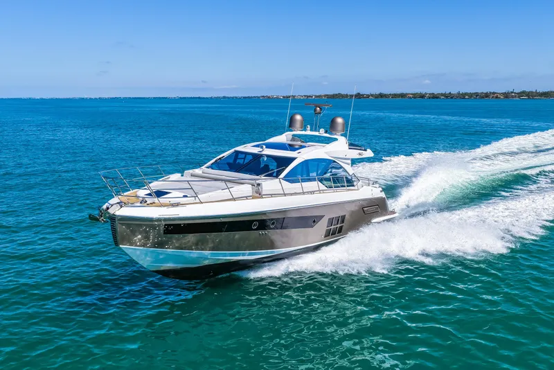 Slide: The Image of 2020 Azimut S6 yacht cruising on clear blue ocean waters. - 74