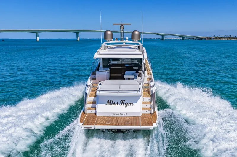 Slide: The Image of Luxury Azimut S6 yacht cruising on clear blue waters near a bridge, 2020 model. - 49