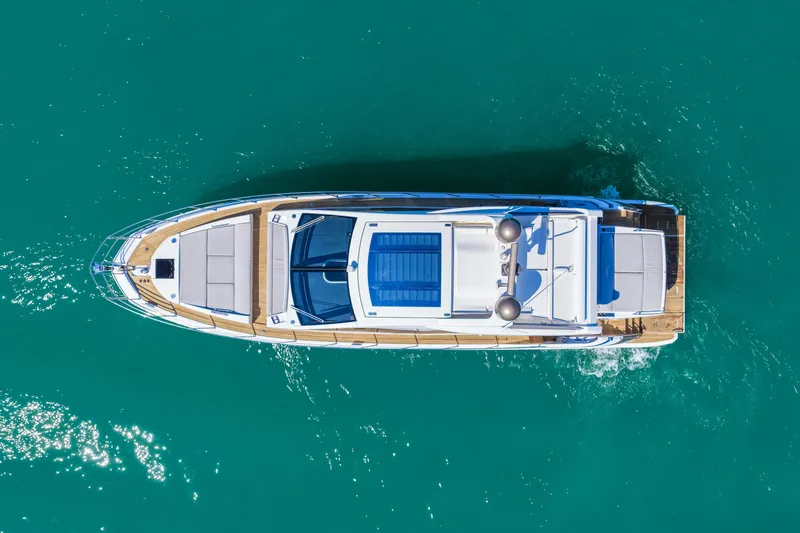 Slide: The Image of Aerial view of 2020 Azimut S6 yacht cruising on turquoise water. - 6