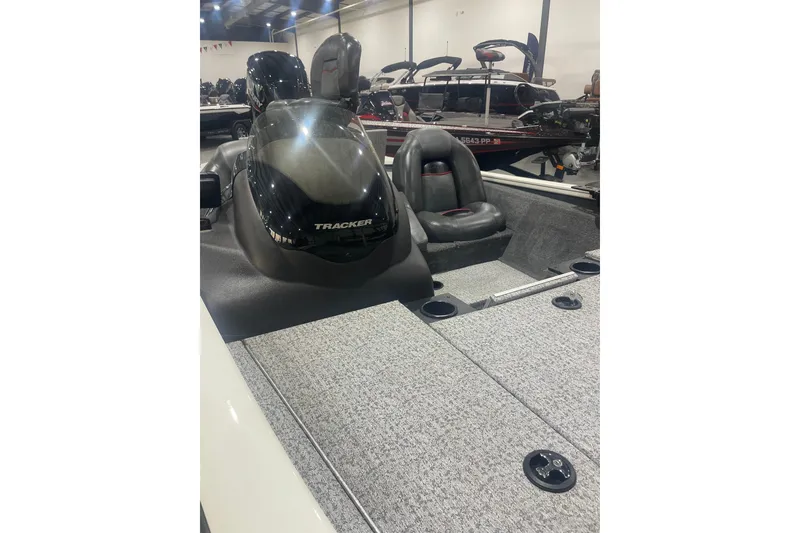 Slide: The Image of 2024 Tracker Pro Team 175 TXW boat interior with seating and dashboard. - 38