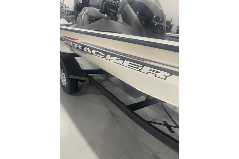 Slide: The Image of 2024 Tracker Pro Team 175 TXW boat on display in showroom. - 39