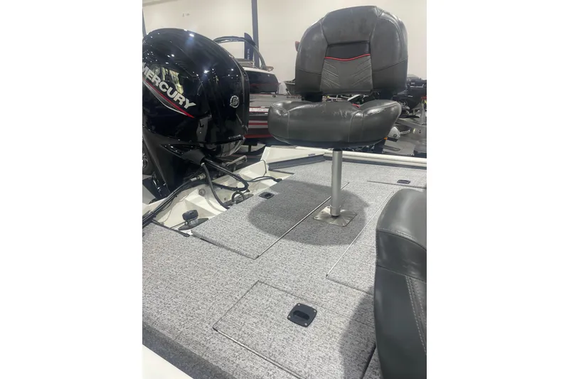 Slide: The Image of 2024 Tracker Pro Team 175 TXW boat with Mercury engine and cushioned seating. - 44