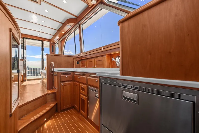 Slide: The Image of Luxurious interior of 2019 Sabre 45 Salon Express yacht with wooden cabinetry and modern appliances. - 18