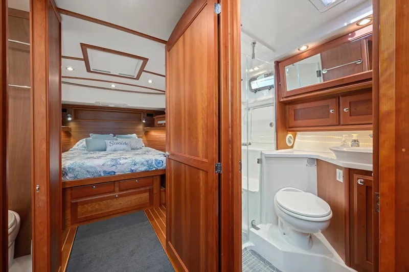 Slide: The Image of Luxurious 2019 Sabre 45 Salon Express interior with cozy bedroom and elegant bathroom. - 39