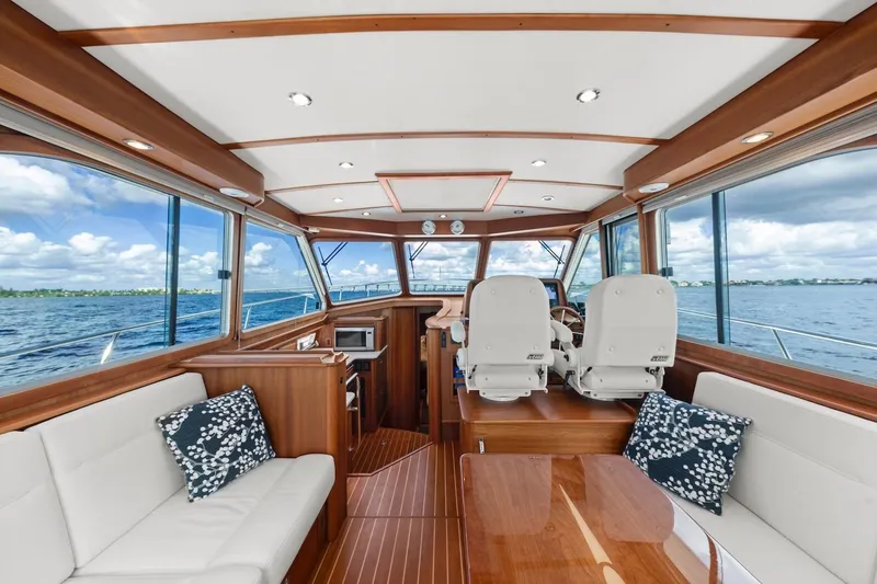 Slide: The Image of 2019 Sabre 45 Salon Express interior with elegant wood finish and ocean view. - 5