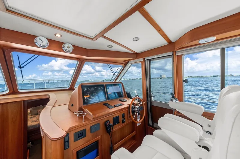 Slide: The Image of Interior of 2019 Sabre 45 Salon Express yacht with helm and ocean view. - 52