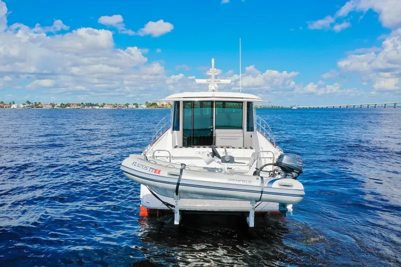 Slide: The Image of 2019 Sabre 45 Salon Express yacht on open water under blue sky. - 67