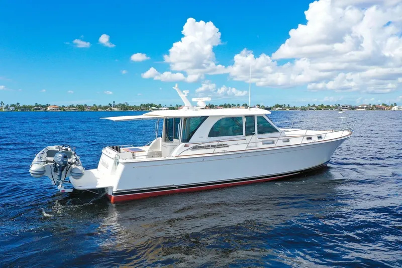 Slide: The Image of 2019 Sabre 45 Salon Express yacht cruising on a sunny day, blue sky and water. - 69
